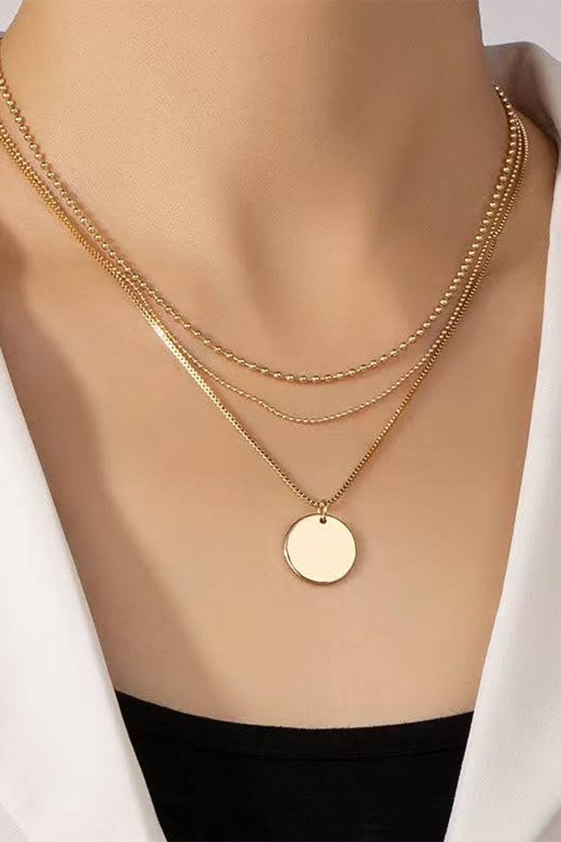 gold necklace with circle pendant
